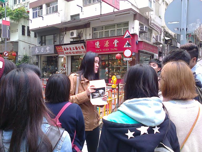 Lecturer Crystal Koo with students in Hollywood Road.