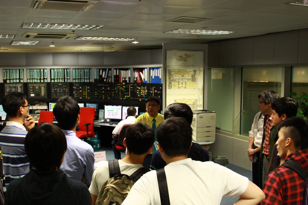 MTR Kowloon Station Manager briefing CIE visitors on the functions of the Station Control Room.