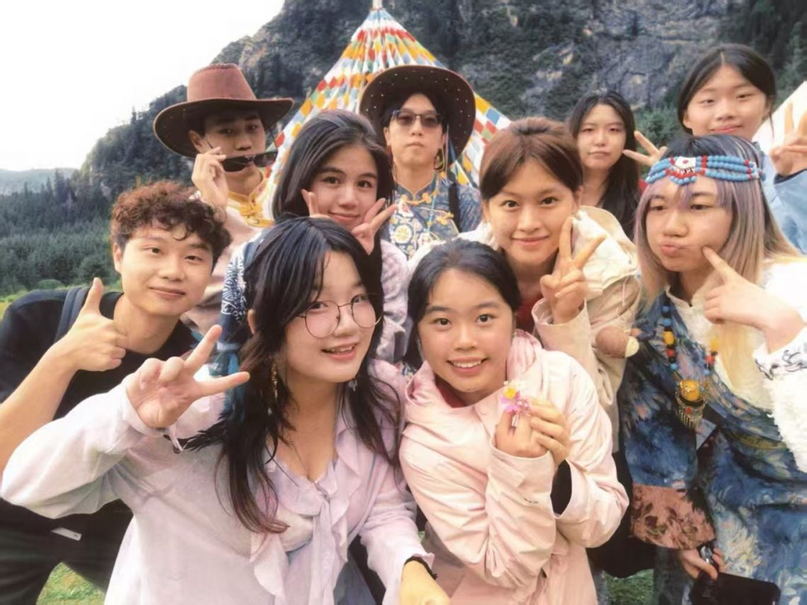 Lorraine Wong (second row, second from left) poses in a student group photo with peers from universities across Hong Kong, Mainland China, and Macau.