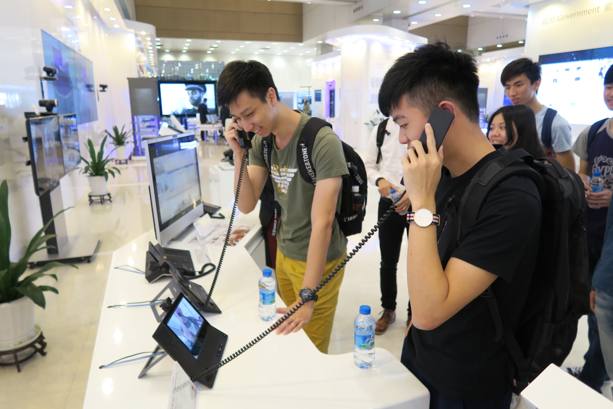 Students try out the video conference equipment.