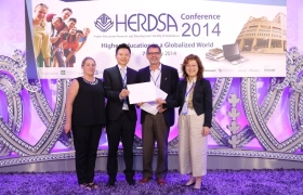 The College of International Education team wins the runner-up poster prize.