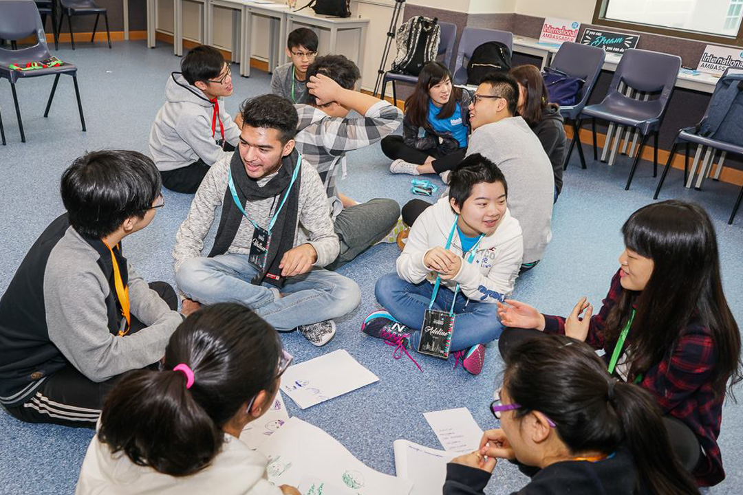 Students gleefully shared their first impressions of each other during an ice-breaking activity.