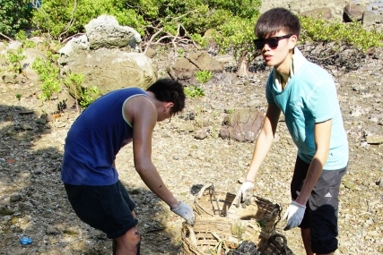 Students separate out the debris.