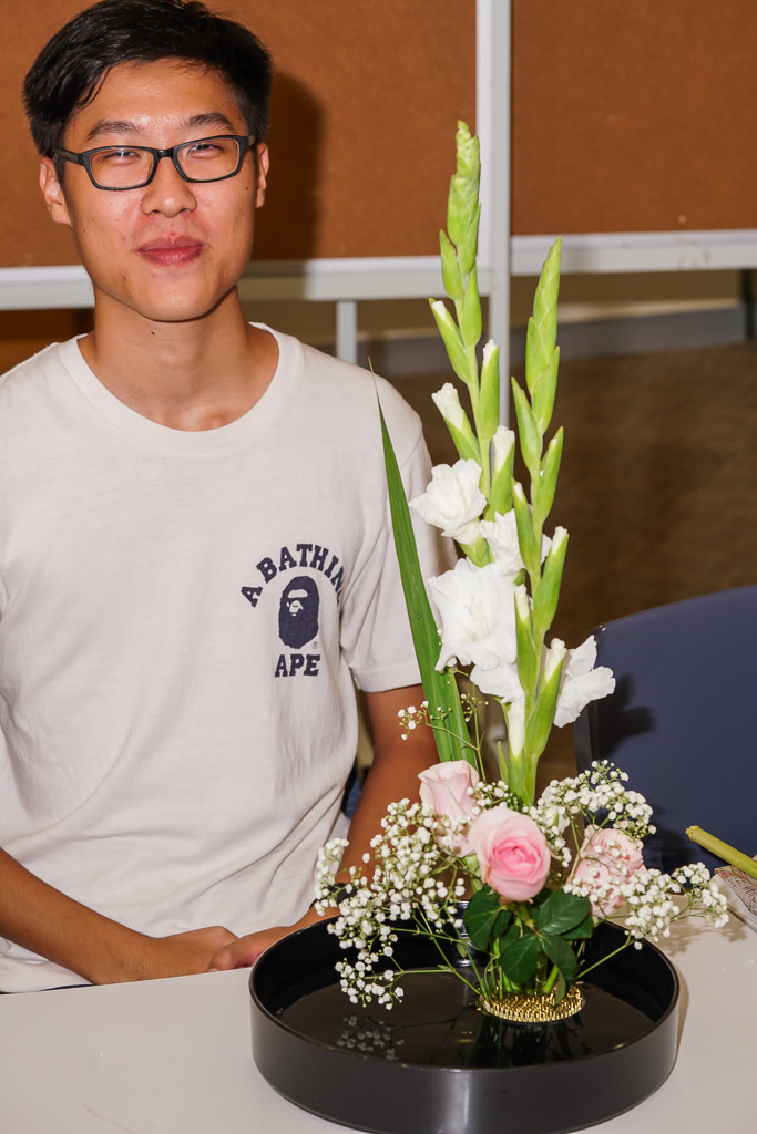 An International Ambassador beams with contentment at his finished product.