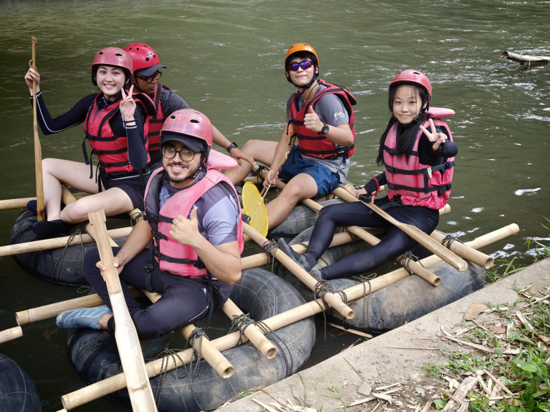 Team raft building using bamboo to travel down the river.